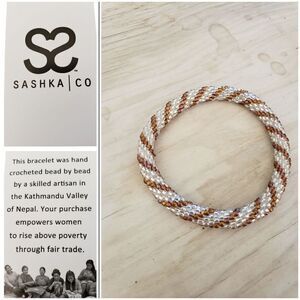 Sashka bracelet, original size, 7" OSFM. Brown and pearlized white.